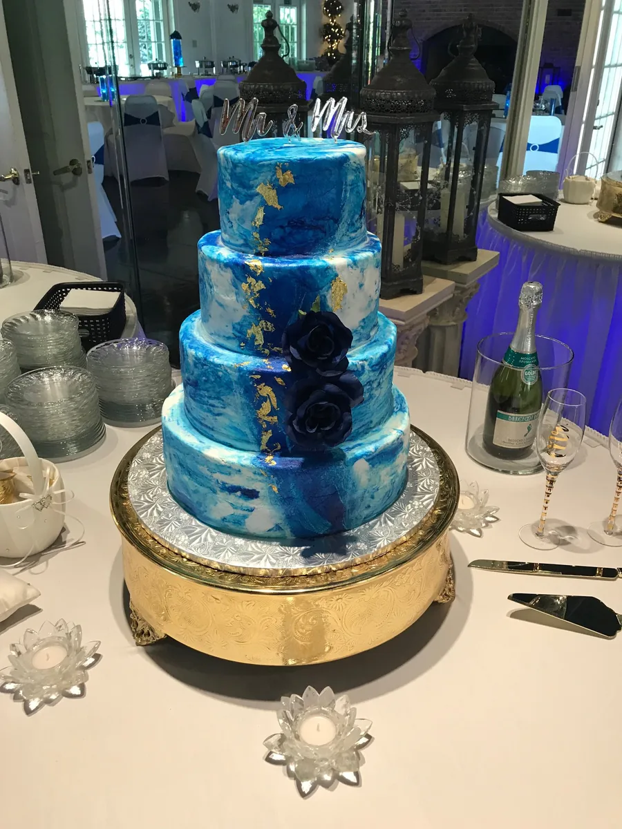 Wedding cake with a soft blue watercolor finish