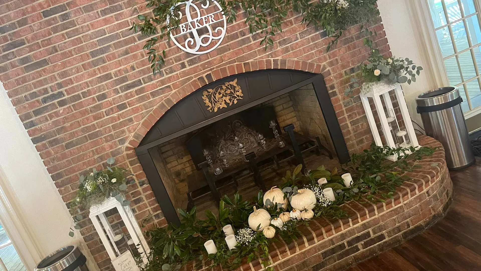 Brick fireplace decorated with florals