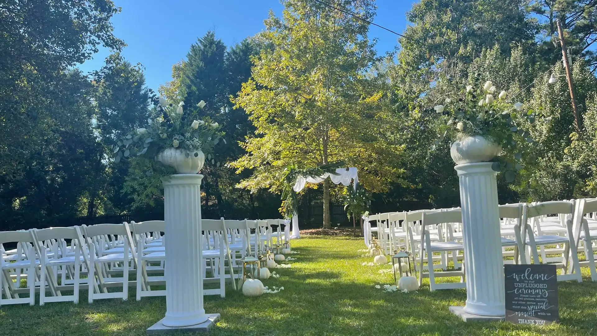 Ceremony aisle framed by white columns