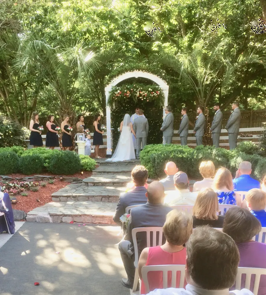 A full ceremony seated before the ivy arch