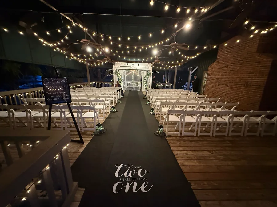 Ceremony on the covered veranda under string lights