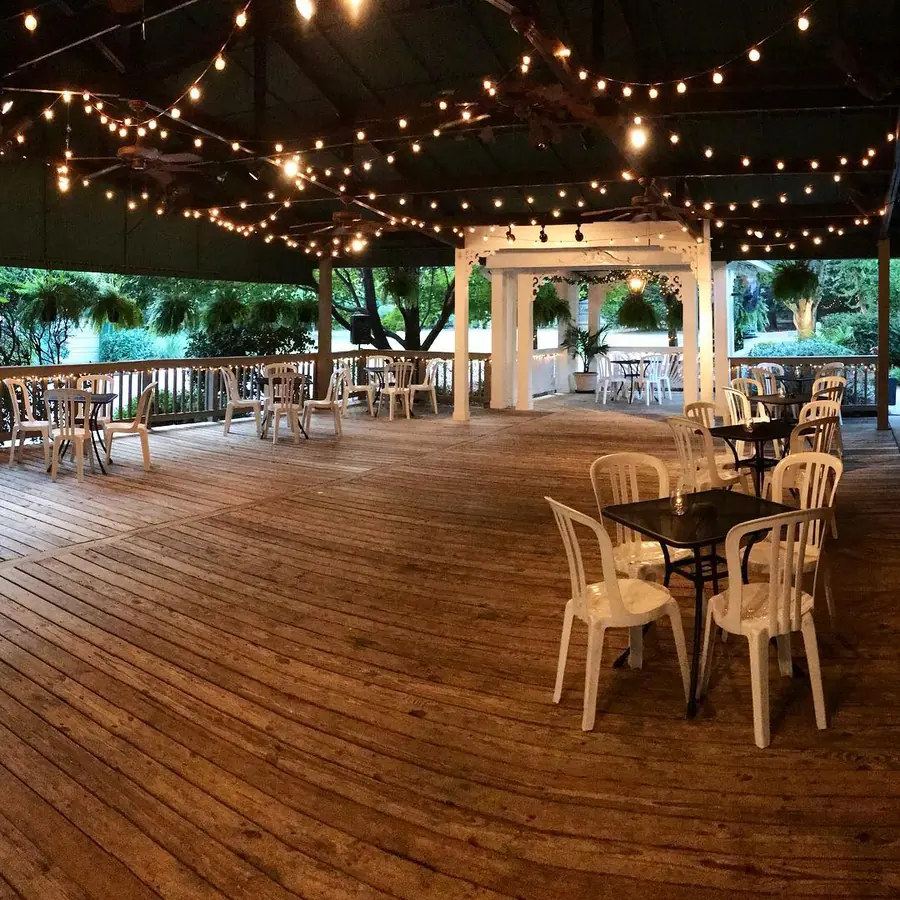 String lights over the deck and gazebo at night