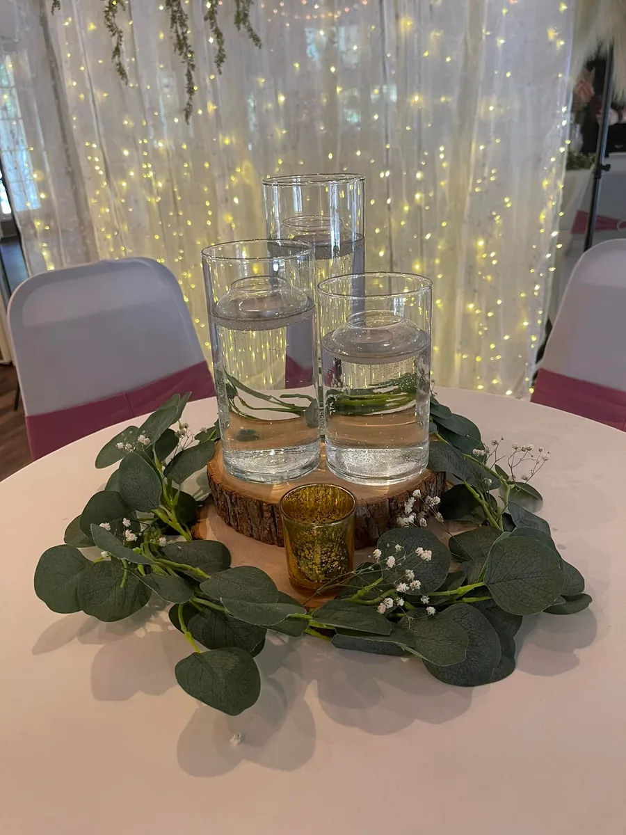 Fairy light backdrop behind a reception table