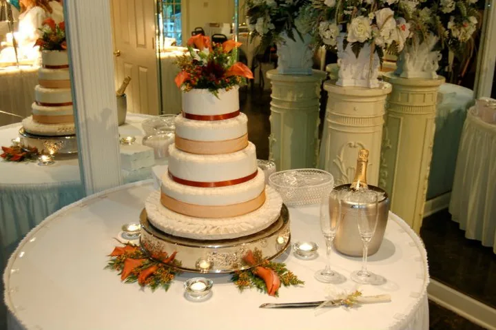 Naked wedding cake trimmed with autumn leaves