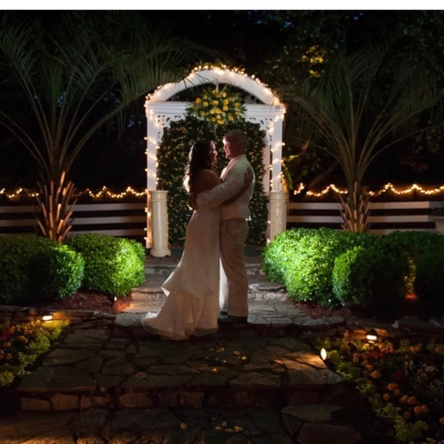 An evening ceremony at the illuminated garden arch