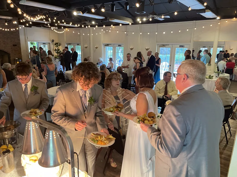 Guests through the buffet in the reception hall