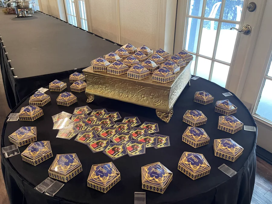 Themed party favors displayed on gold stands