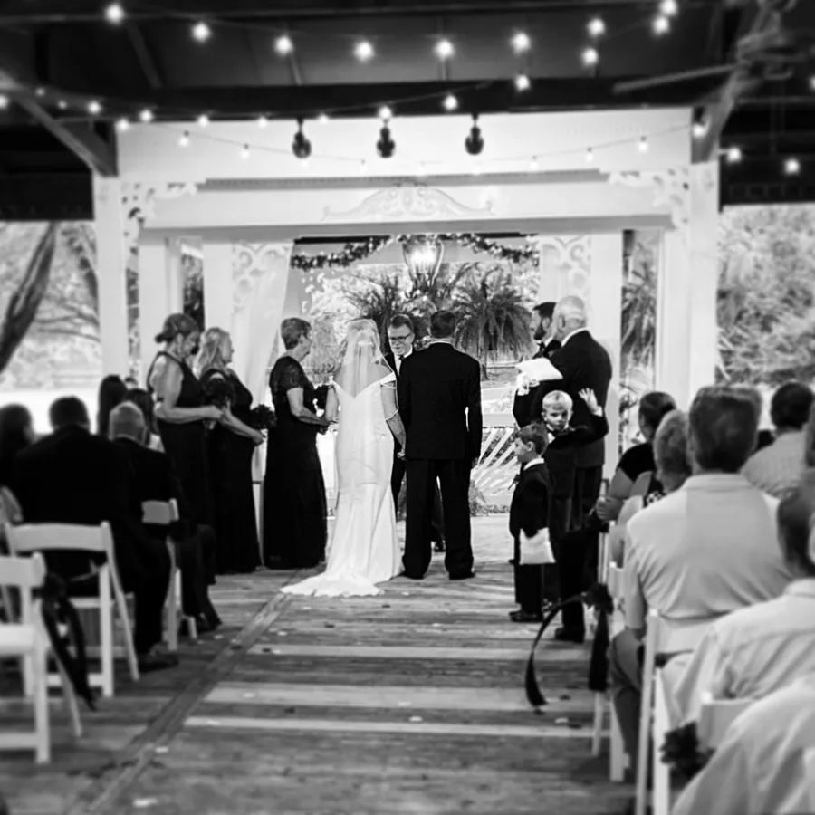 A veranda ceremony captured in black and white