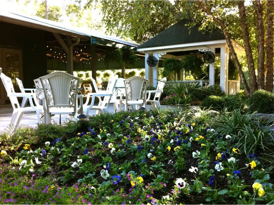 Veranda edged with pansy beds