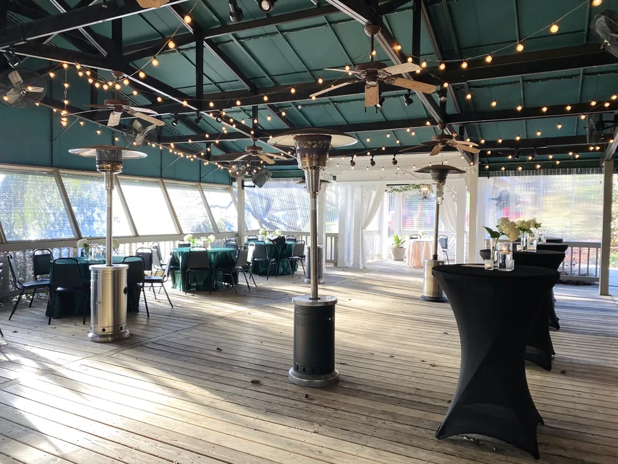 The covered veranda under string lights