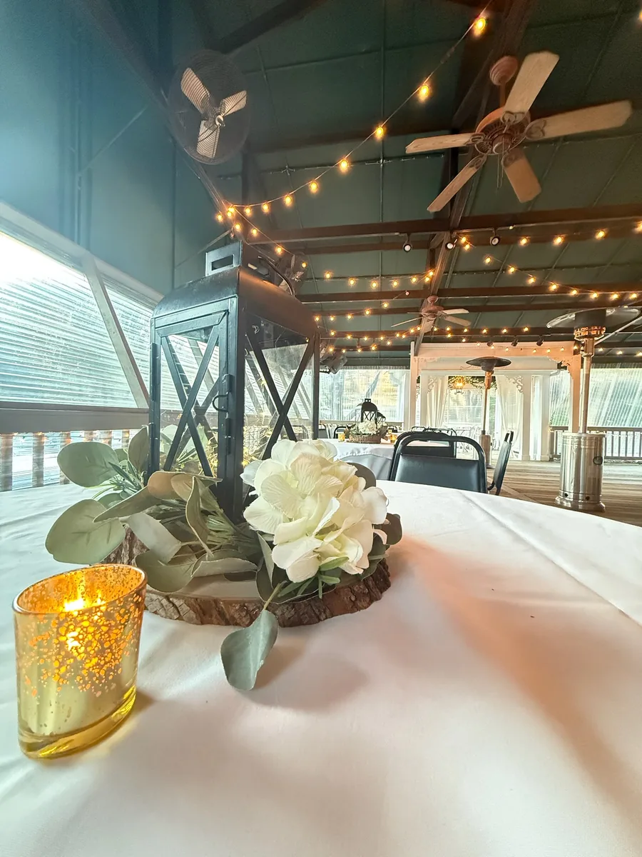 Wood slice centerpiece with candle and flowers